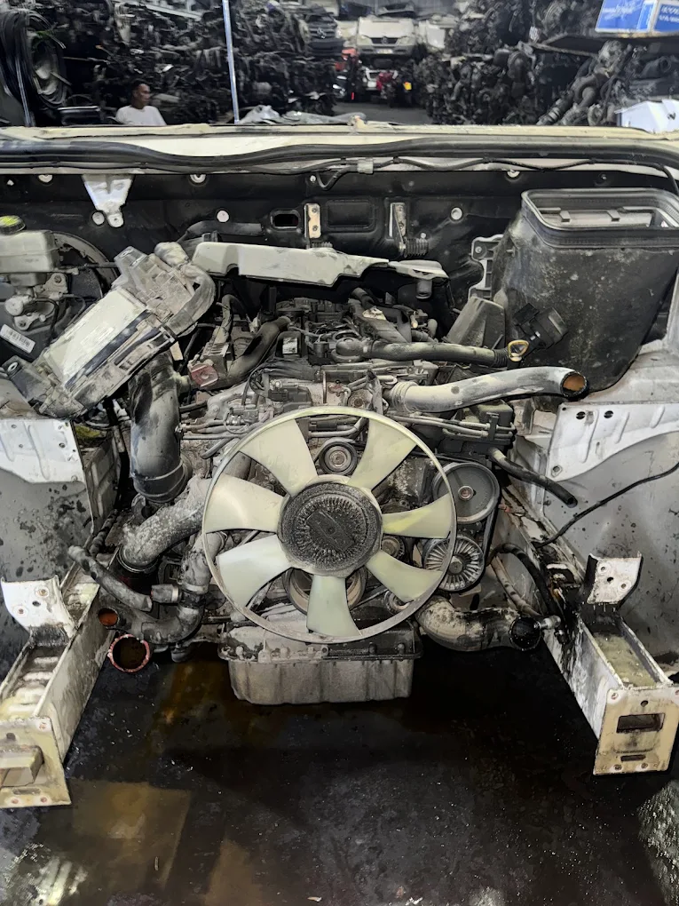 Engine bay of a vehicle being depolluted and stripped