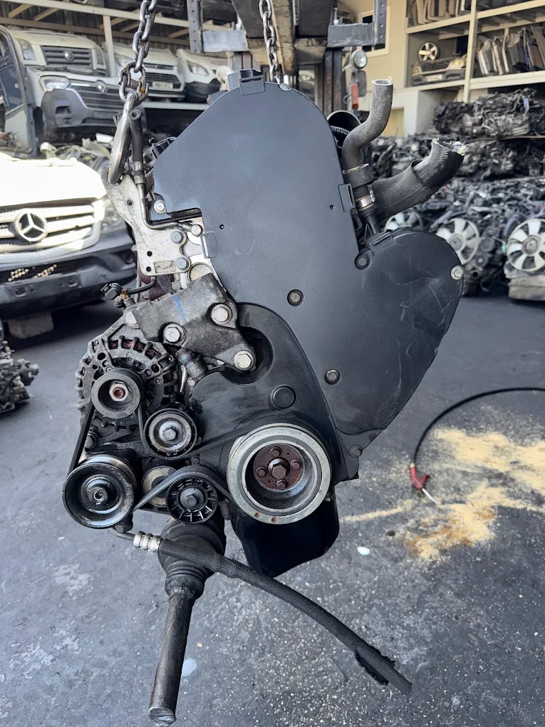 Engine lifted out of a vehicle on chains